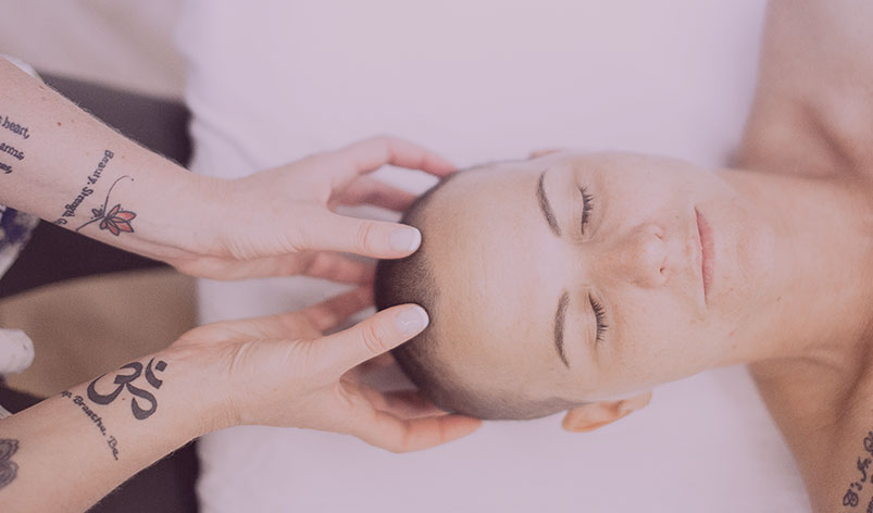 person with eye closed getting a massage